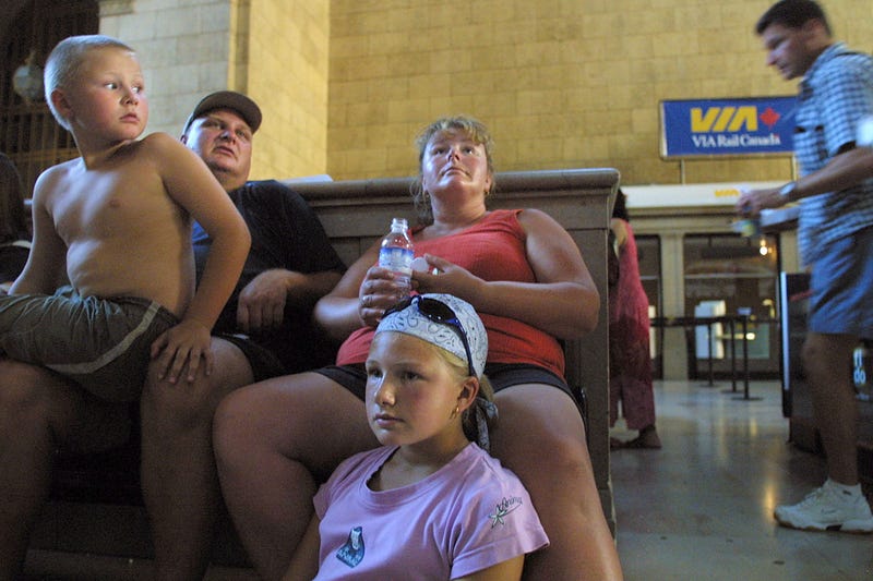 New York wasn't the only city that blacked out in 2003. Here, a family of tourists from Dorset, England is stranded in Toronto's Union Station without air conditioning.