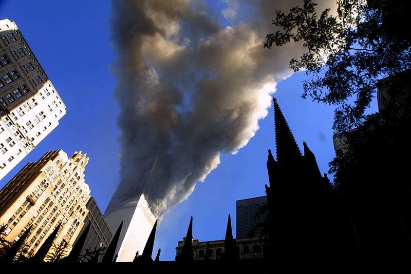 Smoke spews from a tower of the World Trade Center September 11, 2001 after two hijacked airplanes hit the twin towers in a terrorist attack on New York City.