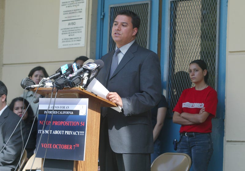 Jose Huizar, a board member of the Los Angeles Unified School District and other representatives from Latino organizations hold a news conference to oppose Proposition 54 outside Garfield High School September 8, 2003 in Los Angeles, California.