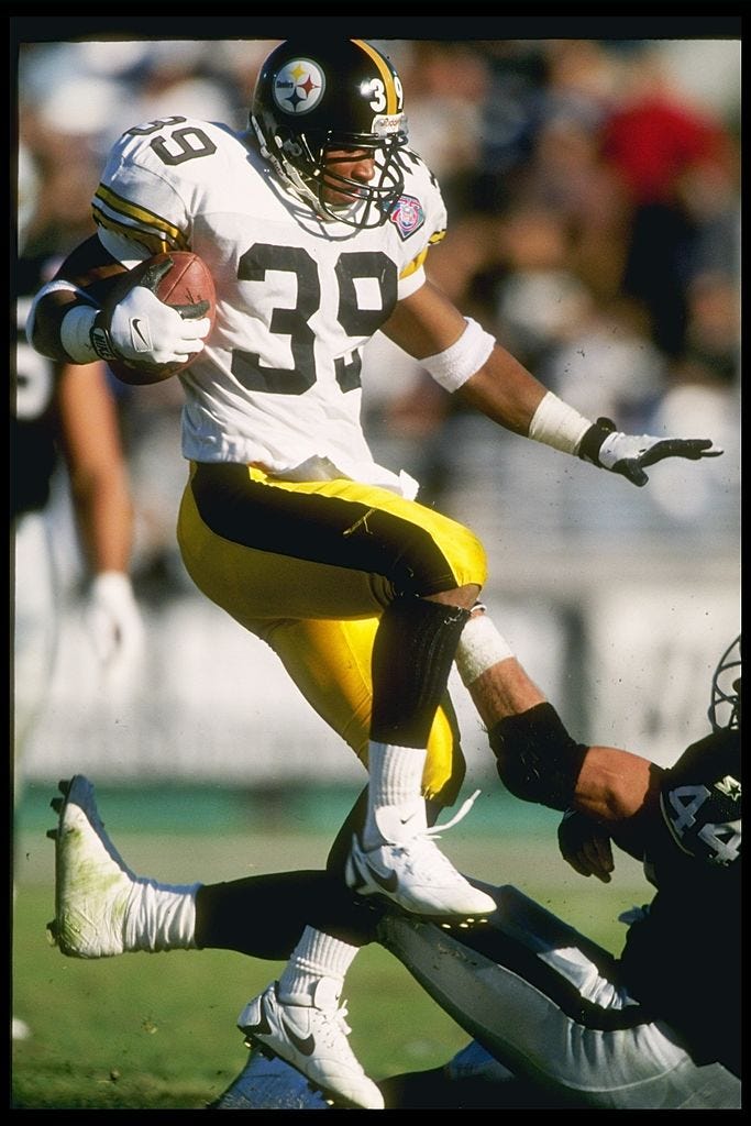 Darren Perry with football vs Raiders