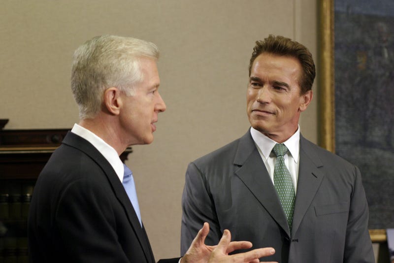 California Governor Gray Davis talks with Governor-elect Arnold Schwarzenegger during a meeting in his office October 23, 2003 at the State Capitol in Sacramento, California.