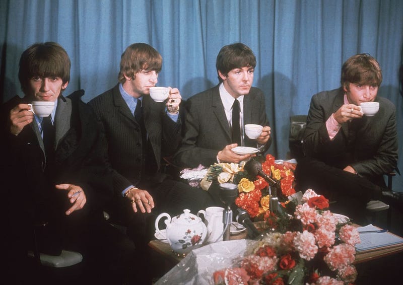 Left to right: George Harrison (1943 - 2001), Ringo Starr, Paul McCartney and John Lennon (1940 - 1980) of The Beatles at a press conference at London Airport, 2nd July 1964, following a tour of Australia. (Photo by Hulton Archive/Getty Images)