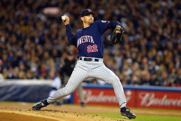 Starting pitcher Brad Radke #22 of the Minnesota Twins delivers a pitch against the New York Yankees during game two of the American League Division Series at Yankee Stadium on October 2, 2003 in the Bronx, New York.