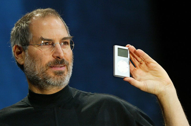 Apple CEO Steve Jobs holds a new mini iPod at Macworld January 6, 2004 in San Francisco.