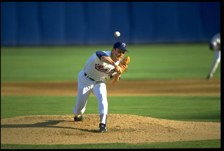 Nolan Ryan throwing a pitch at Arlington Stadium