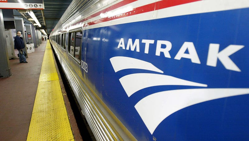 An Amtrak passenger waits for his train at Penn Station April 2, 2004 in New York City.