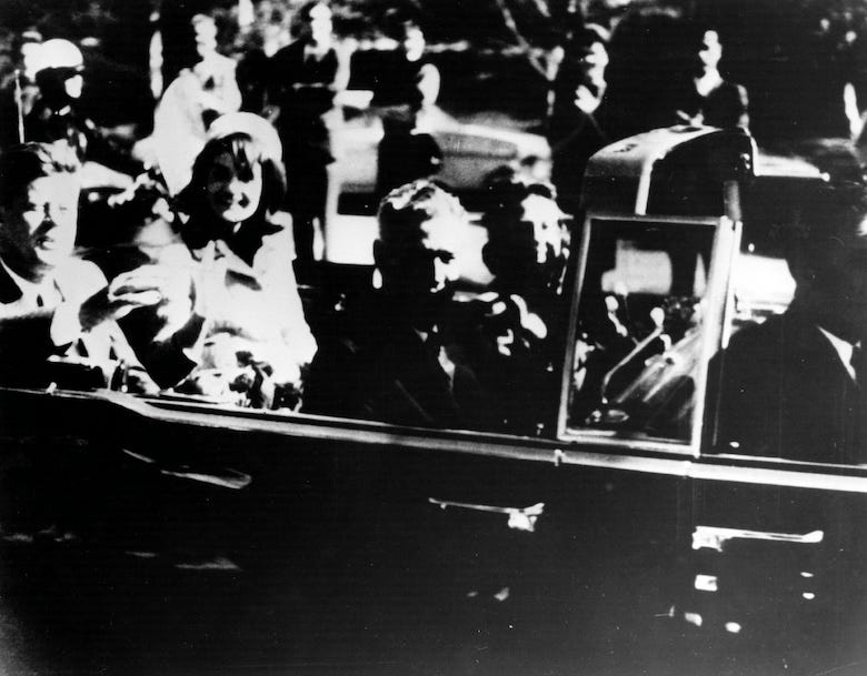 President John F. Kennedy and First Lady Jacqueline Kennedy ride with Texas Governor John Connally and others in an open car motorcade shortly before the president was assassinated in Dallas, Texas, November 22, 1963.