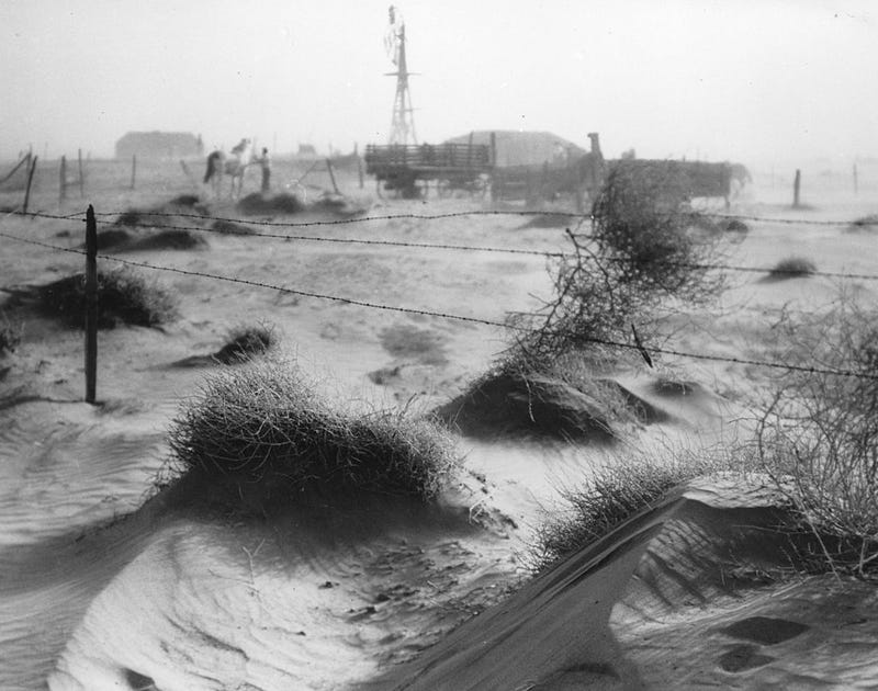 A dust bowl farmstead in Texas, showing the desolation from dust and wind adding to the problems of the Great Depression.