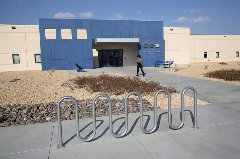  A family member walks into the Adelanto Detention Facility on November 15, 2013 in Adelanto, California.