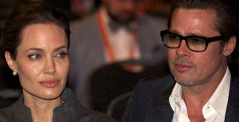 U.N. Special Envoy and actress Angelina Jolie (L) and actor Brad Pitt (R) attend the Global Summit To End Sexual Violence In Conflict in London, United Kingdom on June 13, 2014.