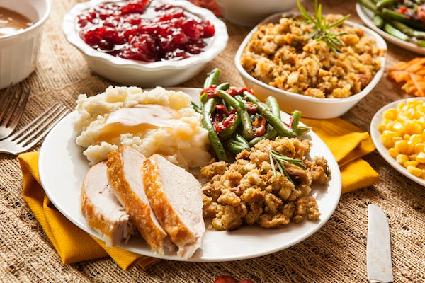 Homemade turkey Thanksgiving dinner with mashed potatoes, stuffing, and corn