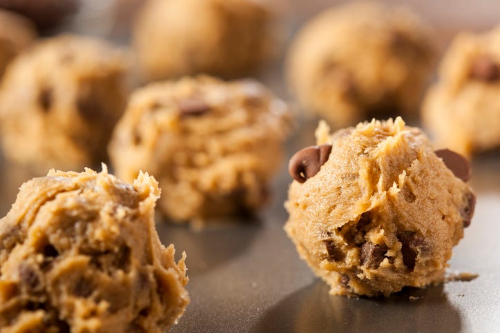 Raw cookie dough on a baking sheet. 