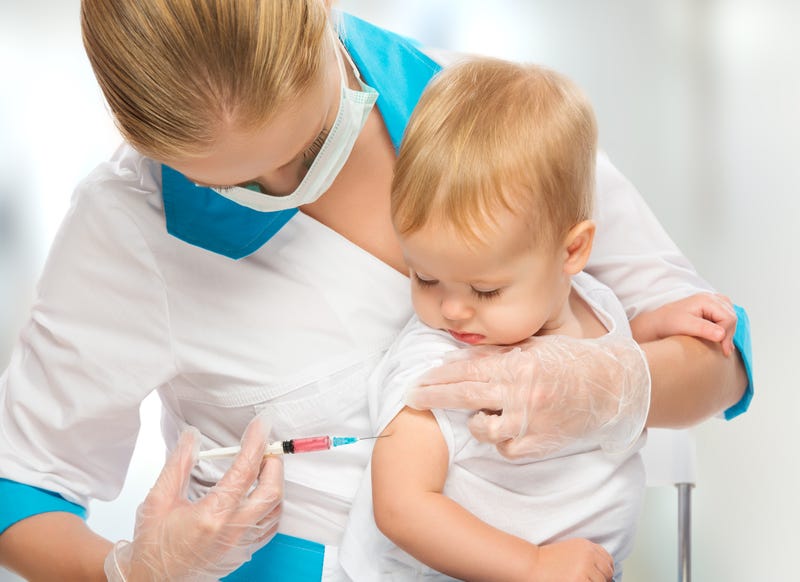 Baby getting a shot stock photo. 