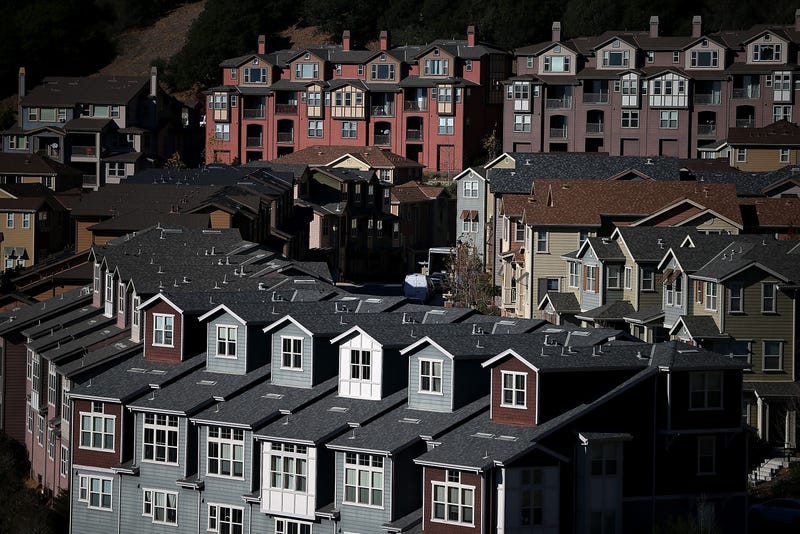Rows of new homes line a street in a housing development on December 4, 2013 in Oakland, California.