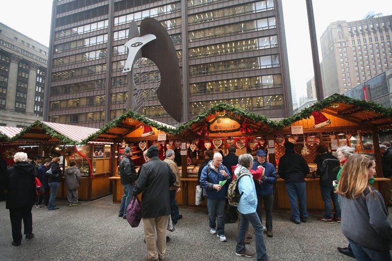 Visitors shop at Christkindlmarket Chicago on December 4, 2013 in Chicago, Illinois. Christkindlmarket Chicago is a German-themed outdoor market open during the Christmas shopping season in Daley Plaza in the Chicago Loop. Vendors sell gifts, crafts, ornaments and traditional German food at the market.