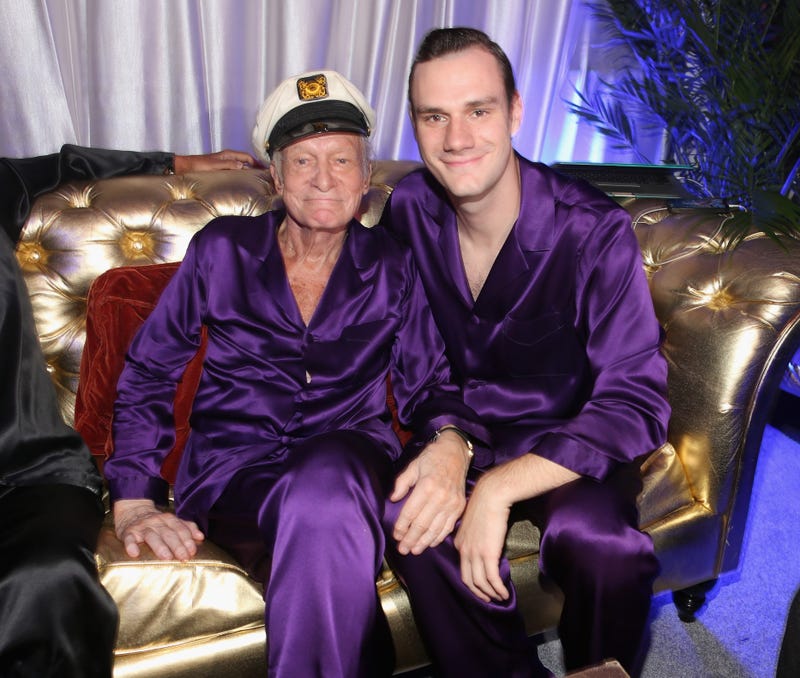 Hugh Hefner (L) and Cooper Hefner attend the Annual Midsummer Night's Dream Party at the Playboy Mansion hosted by Hugh Hefner on August 16, 2014 in Holmby Hills, California.
