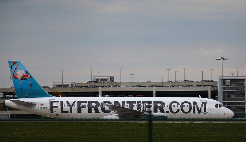 A Frontier Airlines plane taxis the runway at Cleveland Hopkins Airport on October 15, 2014 in Cleveland, Ohio.