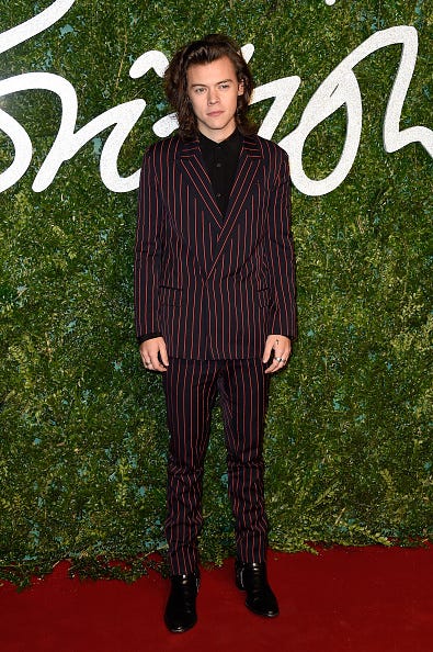 harry styles in stripes at british fashion awards