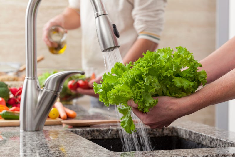 washing lettuce in the sink