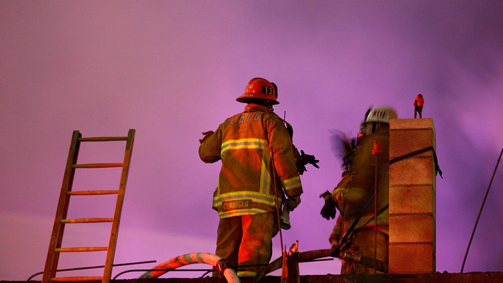 Man in critical condition after being rescued from burning home by LAFD