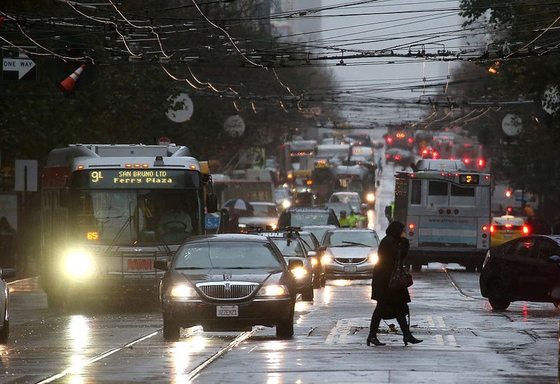  A pedestrian walks in the rain on December 11, 2014 in San Francisco, California.
