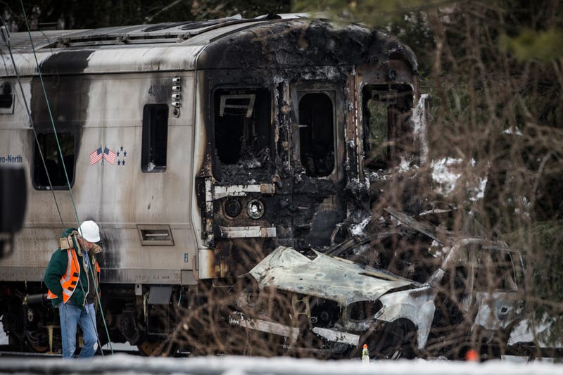Officials inspect a Metro-North train crash with a sport utility vehicle on Feb. 4, 2015 in Valhalla, New York