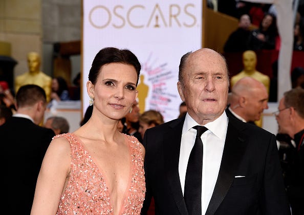 Luciana Pedraza (L) and actor Robert Duvall attend the 87th Annual Academy Awards at Hollywood & Highland Center on February 22, 2015 in Hollywood, California. (Photo by Kevork Djansezian/Getty Images)
