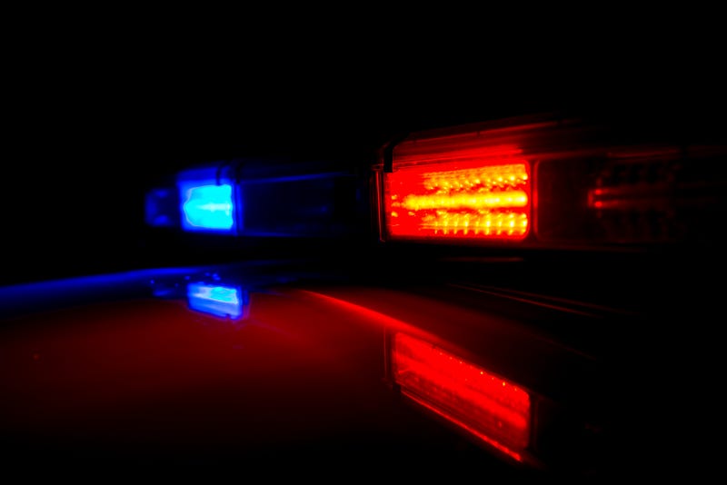 Stock image of a police car with lights on