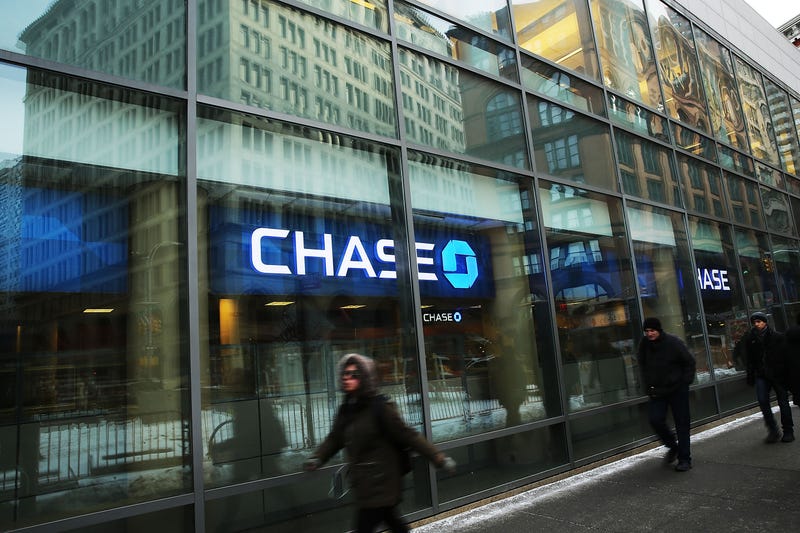 People walk past a Chase bank branch in Manhattan on February 24, 2015 in New York City.