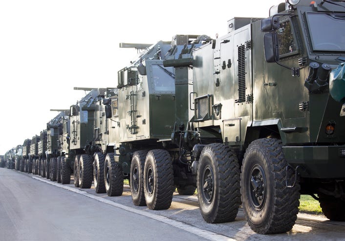 Military trucks lined up. 