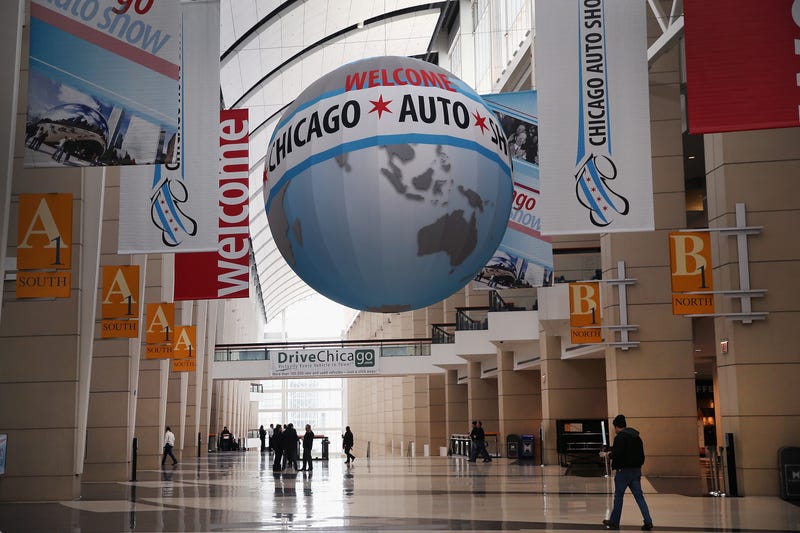 Workers prepare for the open of the Chicago Auto Show on February 5, 2014 in Chicago, Illinois