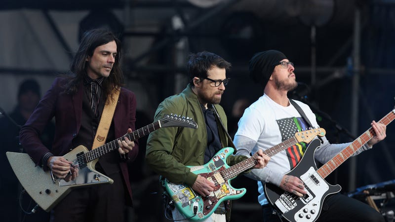 Brian Bell, Rivers Cuomo, and Scott Shriner of Weezer