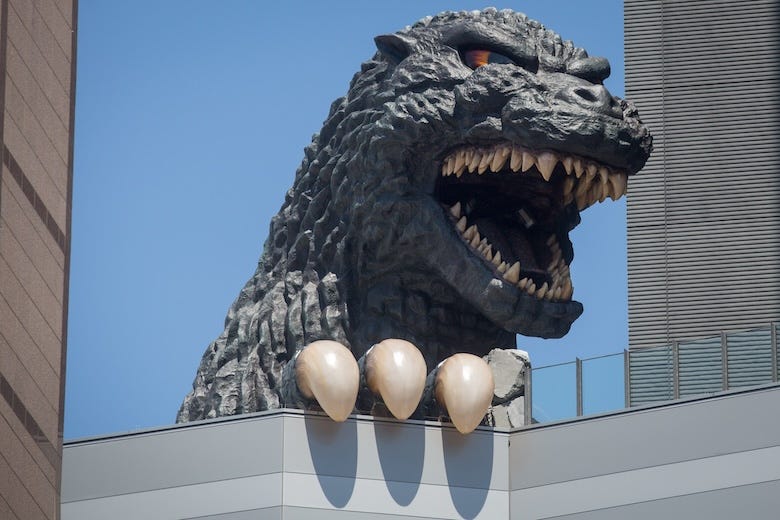 A 12 meter tall Godzilla replica head is seen on the 8th floor terrace of the Hotel Gracery Shinjuku on April 15, 2015 in Tokyo, Japan.