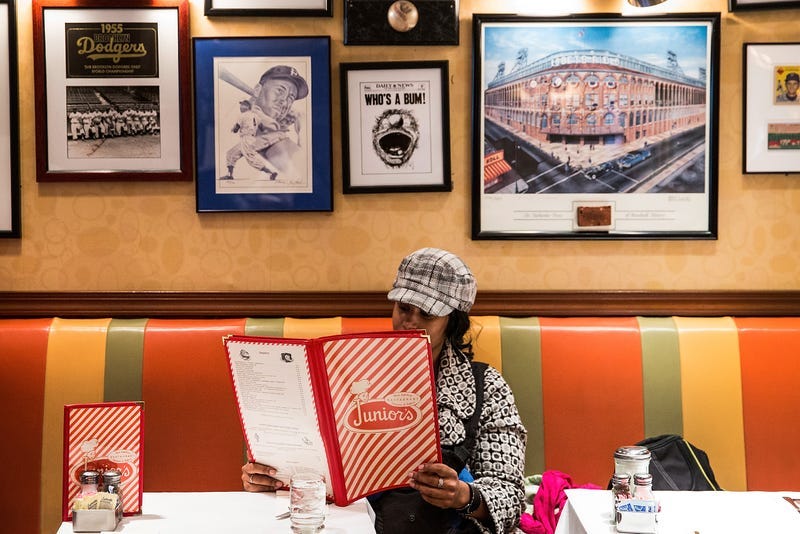 A woman looks at the menu at Junior's Restaurant on February 21, 2014 in the Downtown Brooklyn