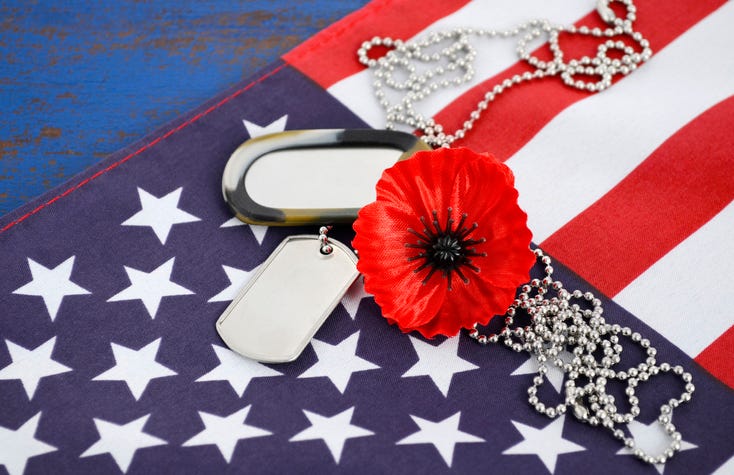 Poppy and ogd tags over an US Flag for Memorial Day