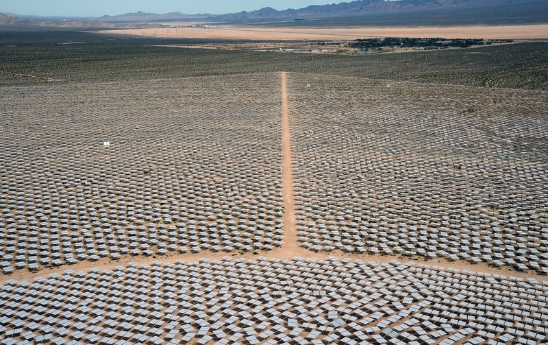  Heliostats at the Ivanpah Solar Electric Generating System are seen from above with the Primm Valley Golf Club in the distance on March 3, 2014 in the Mojave Desert in California near Primm, Nevada.
