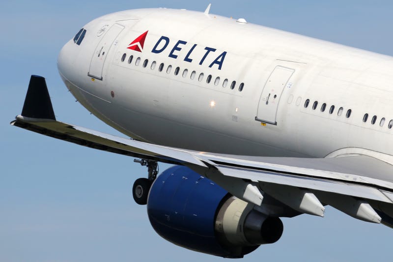 A Delta Airlines pilot says he had to make an "aggressive maneuver" to avoid colliding with a B-52 bomber as his plane approached Minot International Airport in North Dakota on Friday.