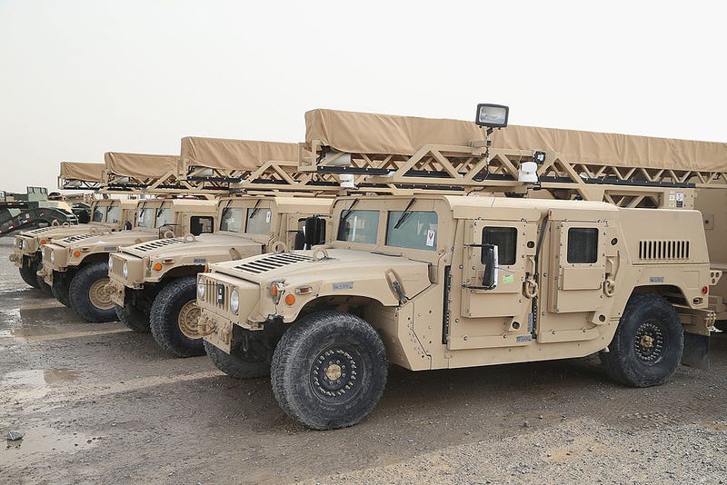 Humvees sit in the Redistribution Property Accountability Team (RPAT) yard at Kandahar Airfield (KAF) on March 8, 2014 near Kandahar, Afghanistan. (Photo by Scott Olson/Getty Images)