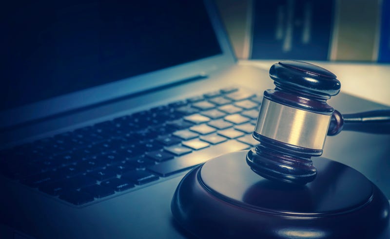 Stock image of gavel on laptop