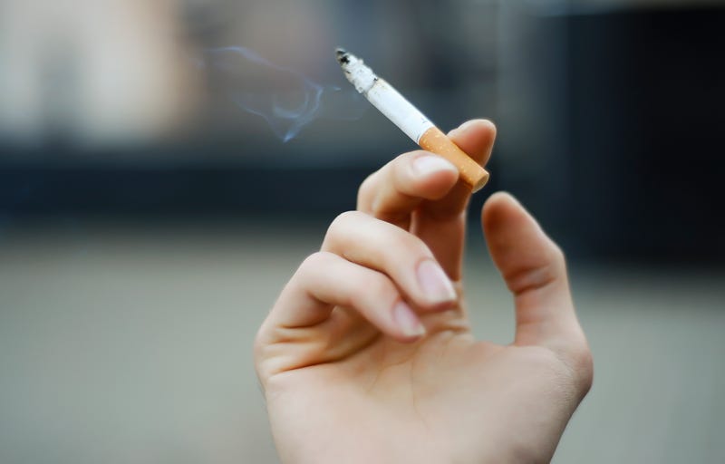 Hand holding a cigarette