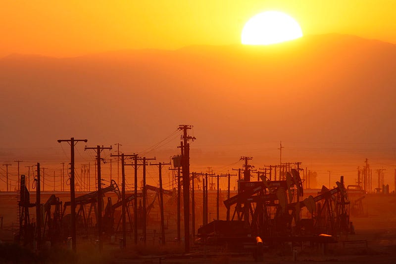 The sun rises over an oil field over the Monterey Shale formation where gas and oil extraction using hydraulic fracturing, or fracking, is on the verge of a boom on March 24, 2014 near Lost Hills, California. Critics of fracking in California cite concerns over water usage and possible chemical pollution of ground water sources.  