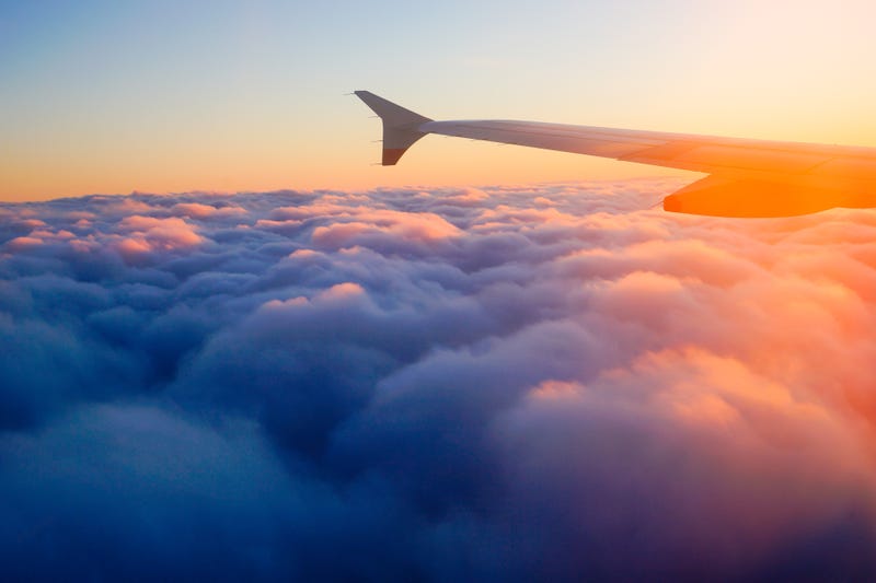Plane wing above the clouds
