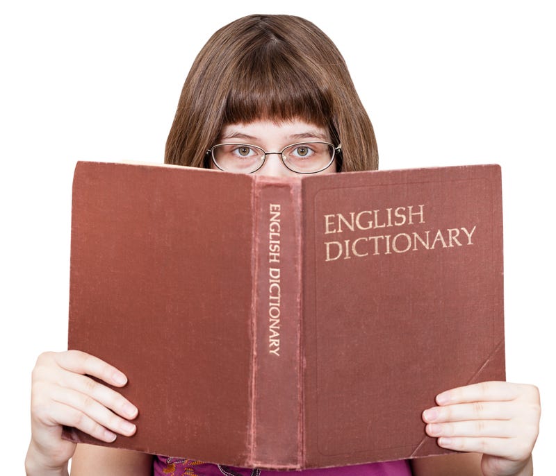 Girl reading dictionary