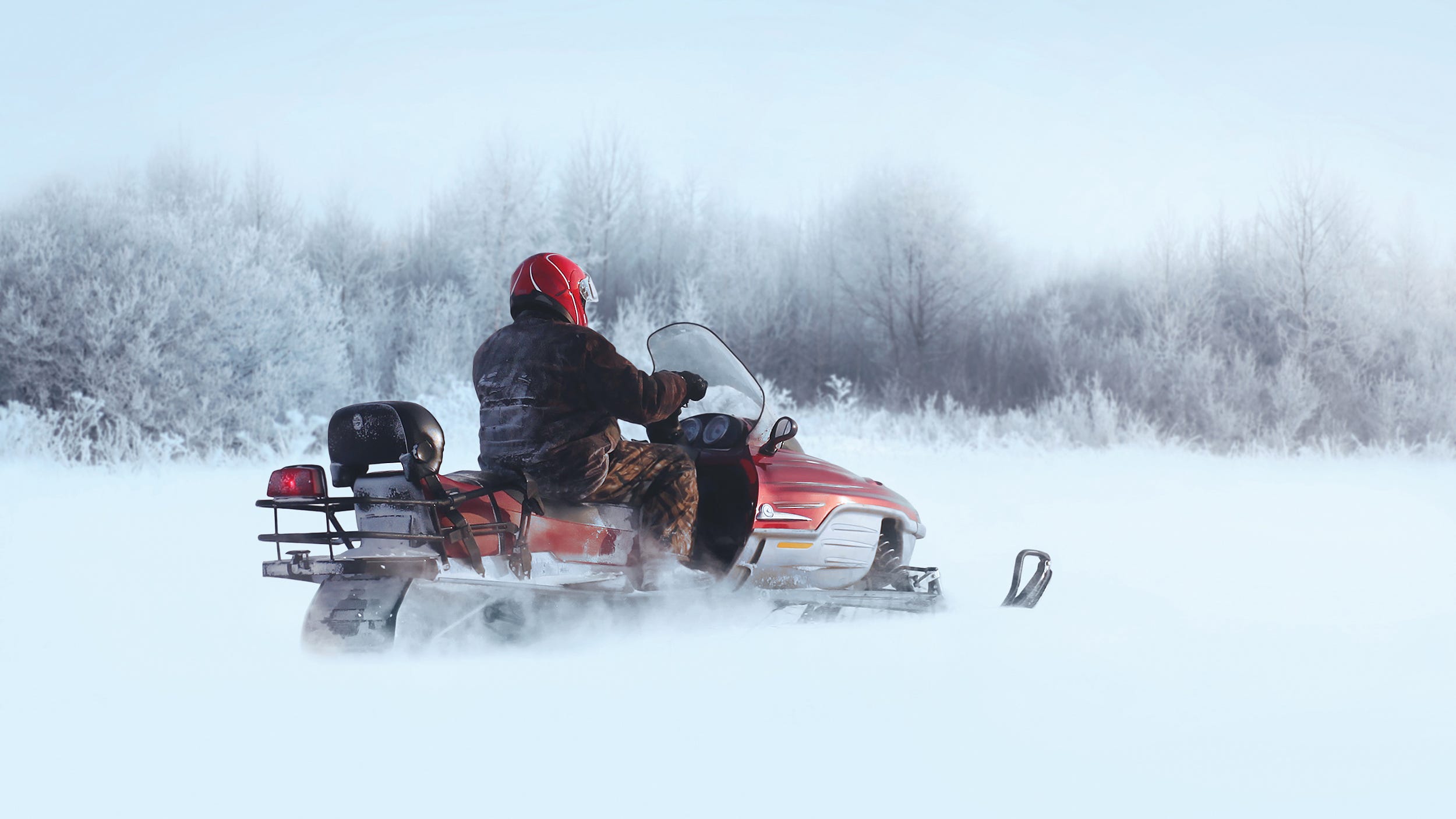 One man dead after snowmobile collides with logging truck in U.P.