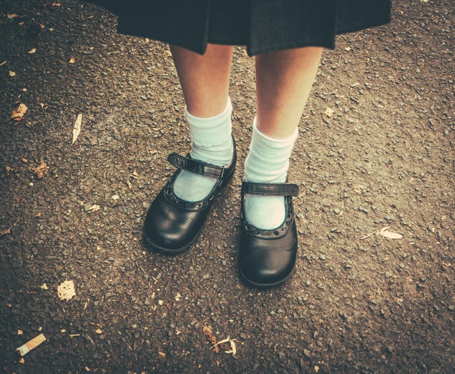 Girl in a school uniform. 