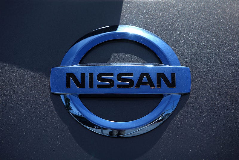 The Nissan logo is displayed on a brand new Nissan car at Nissan Marin on May 1, 2014 in San Rafael, California. 