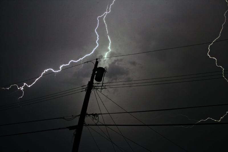 Lightning strike and a power line.