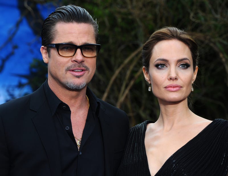 Brad Pitt and Angelina Jolie attend a private reception as costumes and props from Disney's "Maleficent" are exhibited in support of Great Ormond Street Hospital at Kensington Palace on May 8, 2014 in London, England.