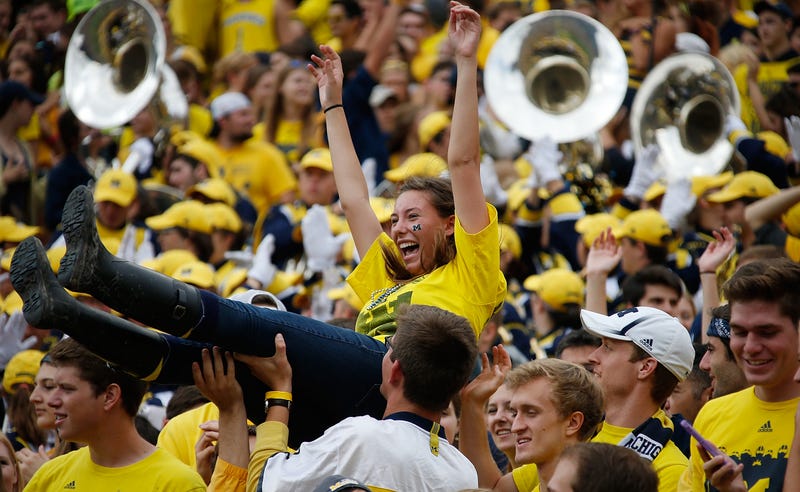 Michigan football fans celebrating