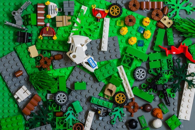 Various Lego bricks scattered around